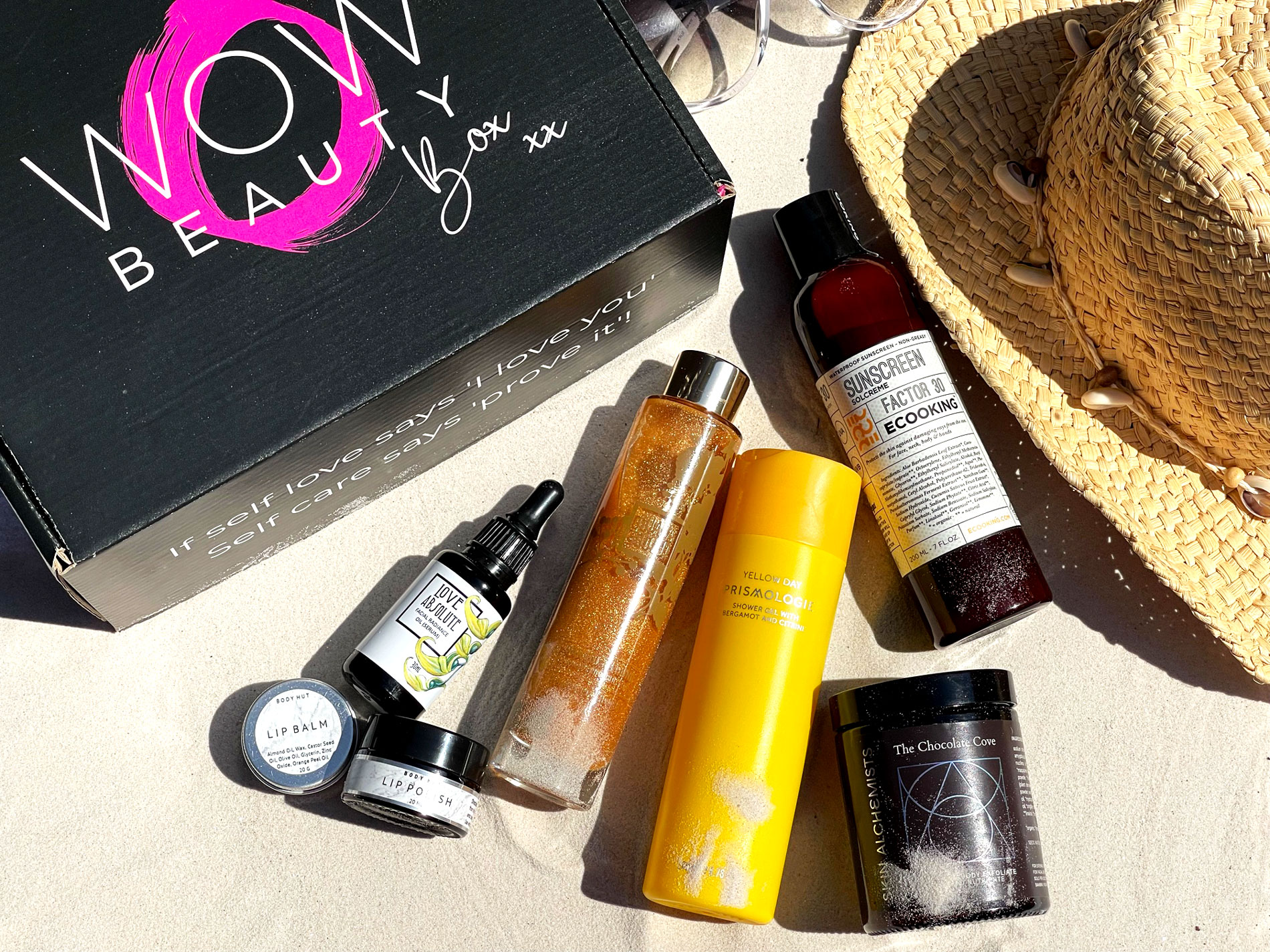 wow beauty box - body hut lip balm and polish, love absolute radiance facial oil, guava and gold shimmering body oil, prismologie shower gel, ecooking spf 30, skin alchemists the chocolate cove exfoliate